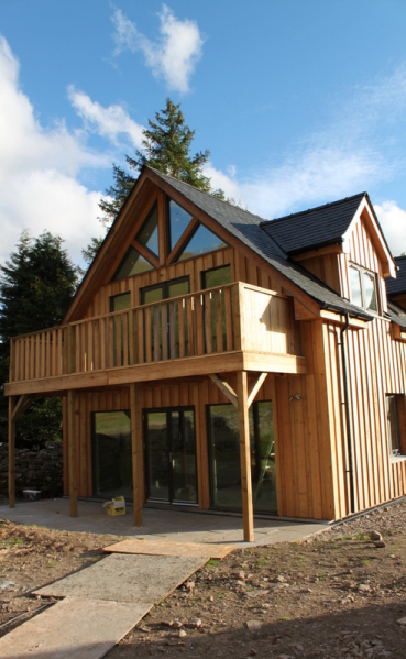 Arnisdale larch-clad elevation with timber balcony